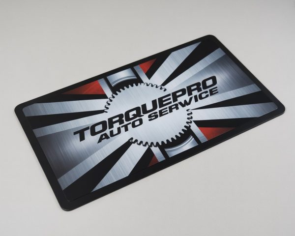Dye sublimation counter mat displayed on a retail checkout counter for brand promotion