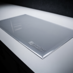 See-through counter mat covering a jewelry display case with logo branding