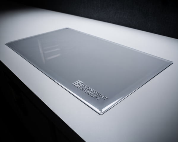 See-through counter mat covering a jewelry display case with logo branding