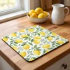 Kitchen counter mat printed with a custom lemon design on a butcher block countertop